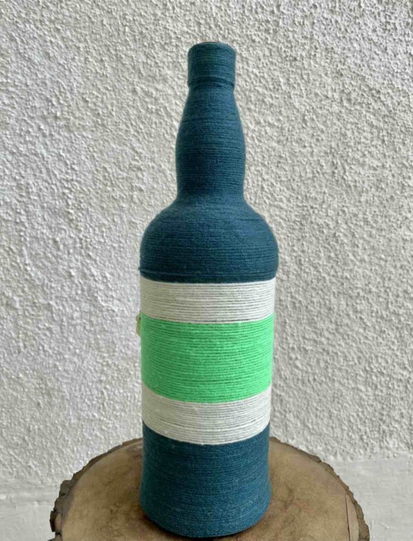 Hand-crafted-yarn-bottle-vase-dull-blue-white-flowers